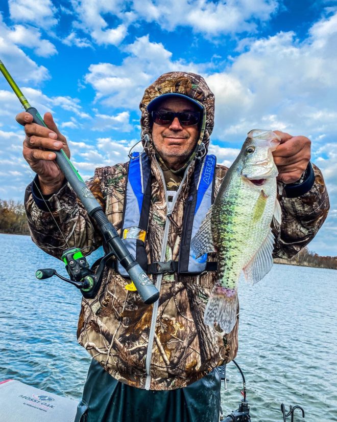 Angler catching crappie on jigging pole in Lake Washington